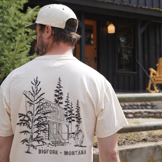 Man wearing rag proper overalls organic cotton classic pocket Bigfork, Montana t-shirt