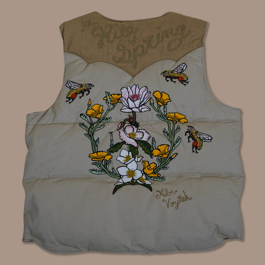 Custom embroidered and hand stuffed down vest celebrating the rite of spring